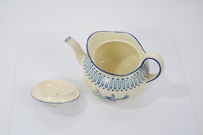 Lot 140 - Wedgwood Queensware small teapot and cover, painted in bright blue enamel with military trophies, circa 1815-20