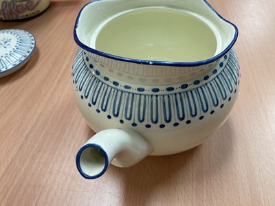 Lot 140 - Wedgwood Queensware small teapot and cover, painted in bright blue enamel with military trophies, circa 1815-20