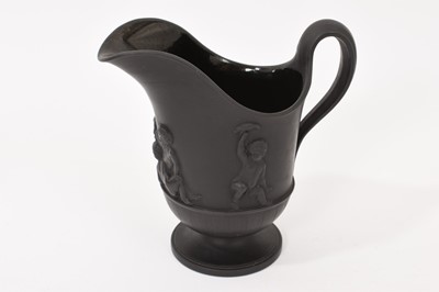 Lot 135 - Wedgwood black basalt helmet shaped jug and matching round bowl circa 1790-1800