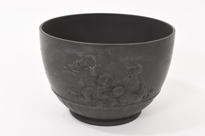 Lot 135 - Wedgwood black basalt helmet shaped jug and matching round bowl circa 1790-1800