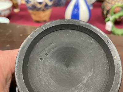 Lot 135 - Wedgwood black basalt helmet shaped jug and matching round bowl circa 1790-1800