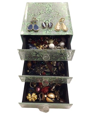 Lot 1042 - Small mirrored three draw jewellery box containing a quantity of mostly clip on earrings including a pair of silver mounted oval agate earrings, pair of carved cameos and a pair of lapis lazuli