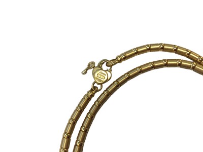 Lot 42 - Zancan 18ct gold chain with tubular links and a key and padlock clasp