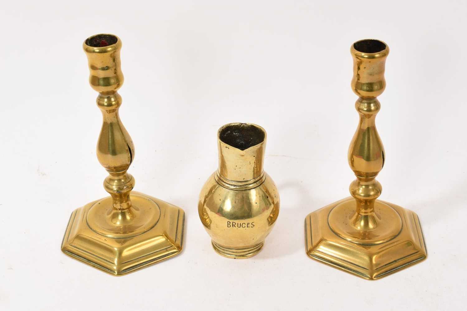 Lot 933 - Pair of Queen Anne brass candlesticks,