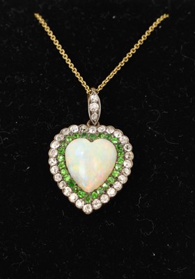 Lot 425 - A fine late Victorian opal diamond and green garnet heart shape pendant on chain