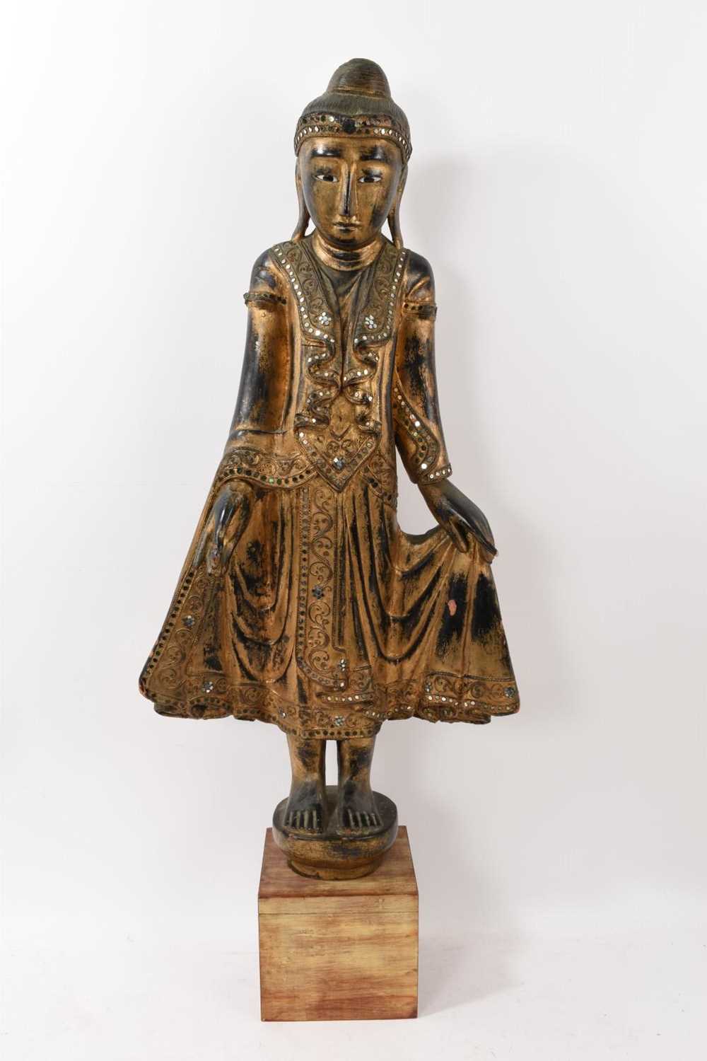 Lot 884 - Large gilt wood budha on stand