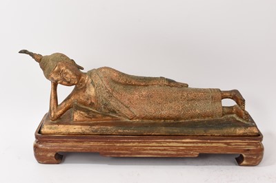 Lot 862 - Thai gilt bronze reclining Buddha on stand