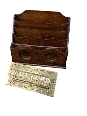 Lot 87 - An Edwardian oak stationery rack with brass 'Post' and 'Delivery' labels, and an Edwardian brass letter box (2)