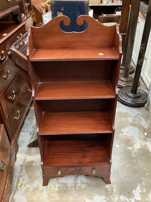 Lot 1310 - Set of small mahogany bookshelves by Redman and Hales,  in the regency manner with scroll top and drawer below