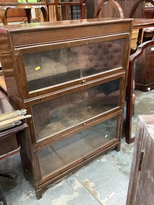 Lot 1323 - Oak three tier stacking bookcase with glazed doors 117cm high, 87cm wide, 25cm deep and childs desk  and chair