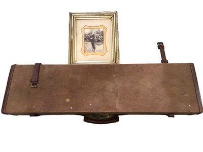 Lot 656 - Canvas covered gun case with associated photograph of boy holding shotgun (2)