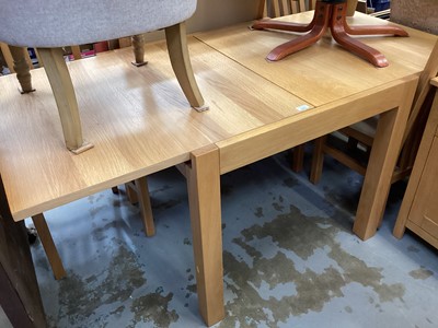 Lot 1331 - Contempory oak extending dining table, four chairs, sideboard and modern glass and metal framed side table