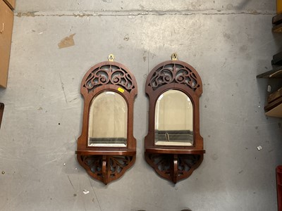 Lot 454 - Pair of Victorian mahogany wall brackets with mirrored backs.