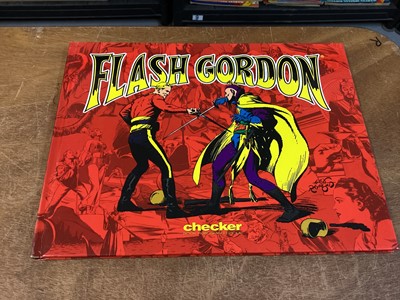 Lot 90 - Dark Horse Comics Softback Mac Raboy's Flash Gordon Vol 1-4 (2003) together with Alex Raymond Hardback Flash Gordon Vol 1-7 (2005) Books