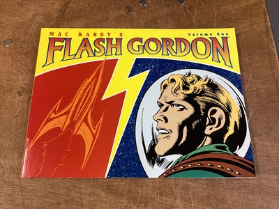 Lot 90 - Dark Horse Comics Softback Mac Raboy's Flash Gordon Vol 1-4 (2003) together with Alex Raymond Hardback Flash Gordon Vol 1-7 (2005) Books