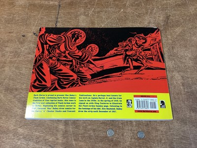 Lot 90 - Dark Horse Comics Softback Mac Raboy's Flash Gordon Vol 1-4 (2003) together with Alex Raymond Hardback Flash Gordon Vol 1-7 (2005) Books