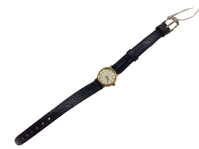 Lot 1085 - Zenith 9ct gold cased quartz wristwatch on black leather strap