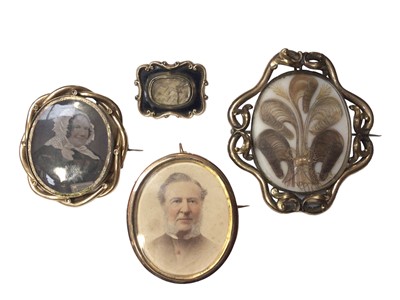 Lot 126 - Four Georgian and later mourning and portrait miniature brooches including two with hairwork designs