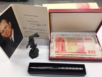 Lot 379 - Bronze model of a hare, indistinctly signed, British Red Cross Society Royal Christmas card, letter opener and a Chinese bank note in resin, boxed