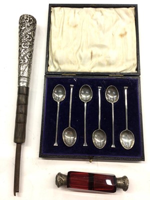 Lot 1093 - Set of six 1920s silver seal top coffee spoons in fitted case, double ended ruby glass scent bottle and a white metal parasol handle