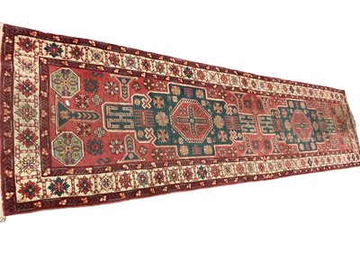 Lot 1380 - Kazak style runner, with two angular medallions, 312 x 79cm