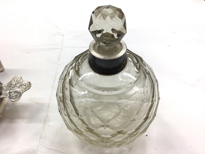 Lot 1099 - Silver framed desk calendar, tea strainer stamped 'sterling', set of six silver (835) coffee spoons with rose decoration, silver handled button hook and a silver collared glass scent bottle