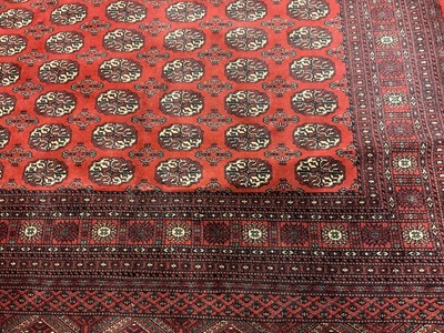 Lot 1384 - Large Tekke style rug, with six rows of sixteen quartered guls, 295 x 197cm