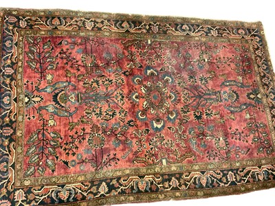 Lot 1389 - Persian rug, with radiating foliage on claret ground, 202 x 102cm, together with another similar 197 x 123cm. (2)