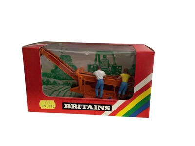 Lot 234 - Britains Potato Harvester No.9535, Low Loader No.9533, Round Baler No.9532 & Gang Roller No.9554, all boxed (4)