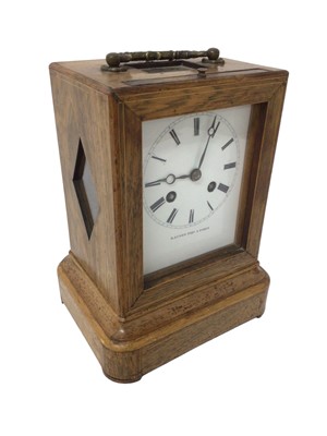 Lot 771 - 19th century French library clock, the white enamel dial signed Raingo Fres, Paris, the movement striking on a bell, contained in a rosewood case with brass carrying handle, 21.5cm high