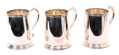 Lot 408 - Set of three 1930s silver mugs