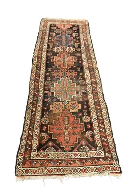 Lot 1426 - Kazak rug with four large medallions