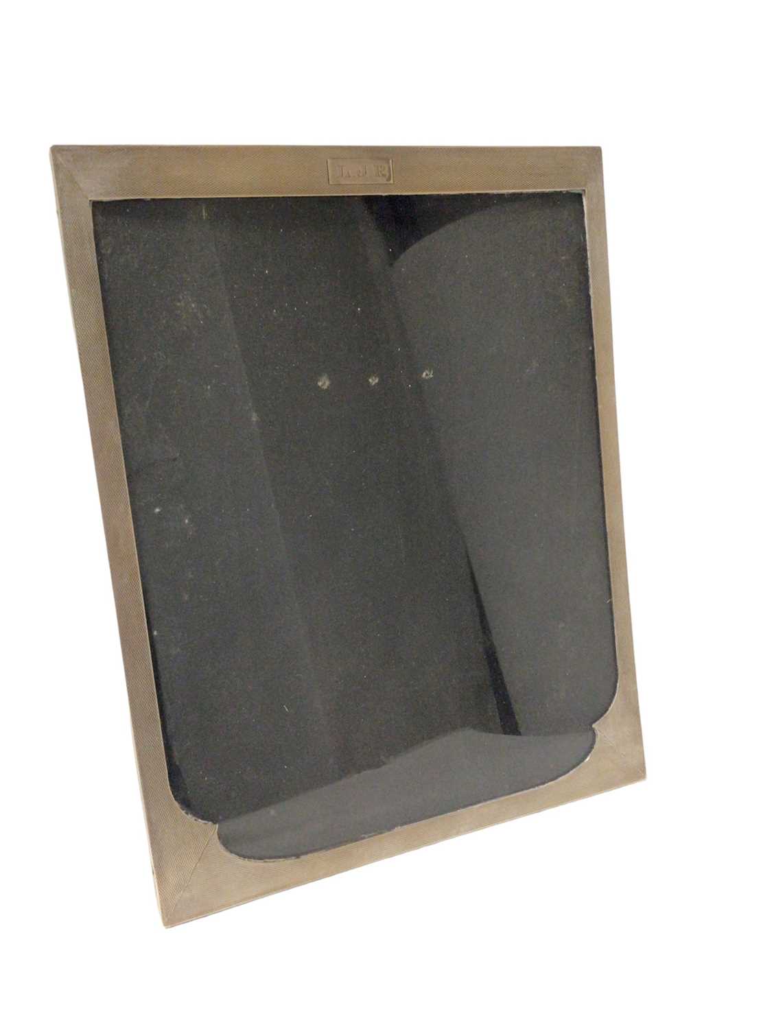 Lot 329 - Silver photograph frame with engine turned