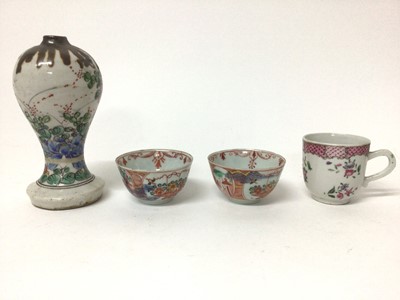 Lot 5 - 18th century Chinese Batavian ware famille rose vase, of baluster form on splayed base, together with a famille rose cup and two clobbered tea bowls (4)