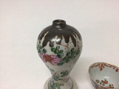 Lot 5 - 18th century Chinese Batavian ware famille rose vase, of baluster form on splayed base, together with a famille rose cup and two clobbered tea bowls (4)