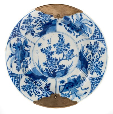 Lot 6 - Chinese blue and white porcelain bowl, Kangxi period, decorated with panels containing precious objects and flowers, with white metal repairs to the rim, seal mark to base, 24cm diameter