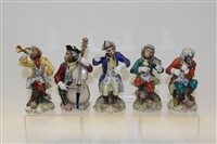 Lot 2055 - Meissen-style five piece monkey band with blue...