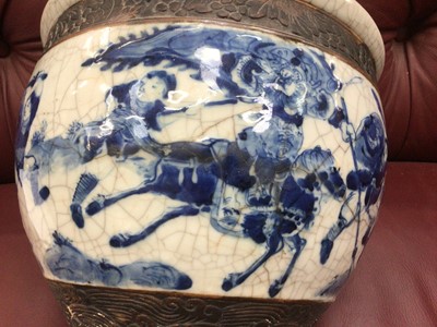 Lot 11 - 19th century Chinese blue and white crackle glazed jardinière, decorated with a continuous battle scene, 27cm diameter x 22cm high