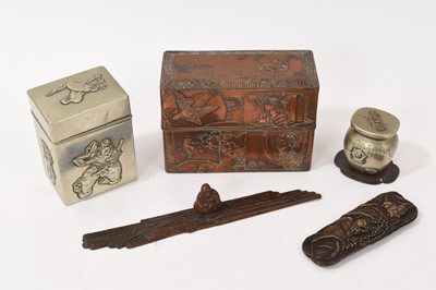 Lot 833 - Japanese works of art, including two relief decorated card boxes, the largest 12cm wide, bronze figural scroll weight, mixed metal inkwell and a bronze mount