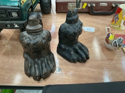 Lot 418 - Pair of cast metal paw book ends