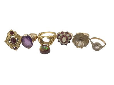 Lot 82 - 14ct gold antique-style garnet three stone cocktail ring, yellow metal amethyst ring, yellow metal claw ring with iridescent opal-like stone (loose) and three 9ct gold gem set dress rings (6)