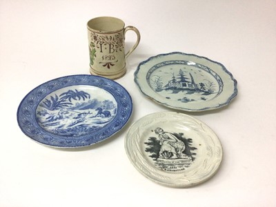 Lot 28 - Creamware mug inscribed with initials and dated 1823, together with three pearlware dishes (4)