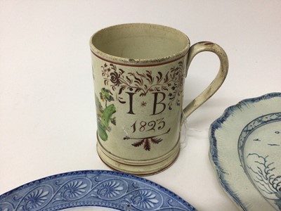 Lot 28 - Creamware mug inscribed with initials and dated 1823, together with three pearlware dishes (4)
