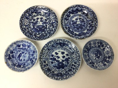 Lot 37 - Set of five 18th century Chinese blue and white porcelain dishes, decorated with foliage, various marks, with wavy rims, 8.5cm to 11cm diameter