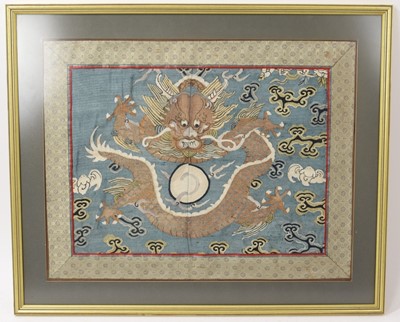 Lot 905 - Chinese dragon embroidery, in silk border, 35 x 47cm, glazed frame