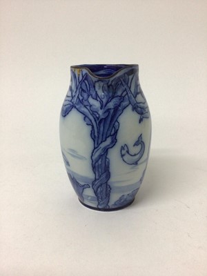 Lot 43 - Early 20th century Royal Doulton flow blue jug decorated in the Art Nouveau style with mermaids and fish, stamped mark, 15cm high