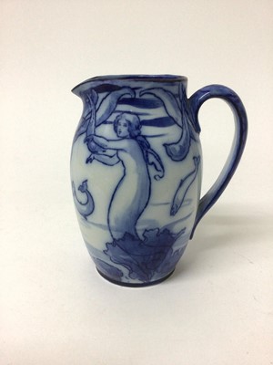 Lot 43 - Early 20th century Royal Doulton flow blue jug decorated in the Art Nouveau style with mermaids and fish, stamped mark, 15cm high