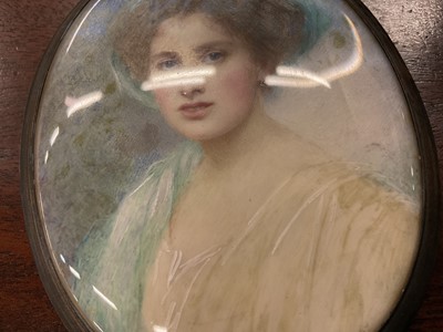 Lot 909 - Mabel Lee Hankey née Hobson (1867-1943): portrait miniature on ivory, depicting a young woman with green hat