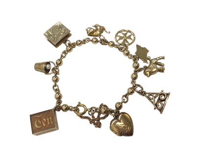 Lot 71 - 9ct gold bead and chain link charm bracelet with nine various charms