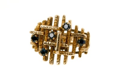 Lot 511 - 1970s 9ct gold and sapphire cocktail ring of abstract design